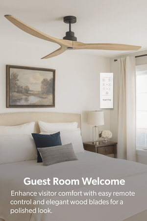 Ceiling fan with wooden blades in a bedroom setting, featuring a bed and wall art.