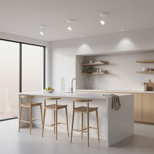 Modern kitchen featuring a white spotlight illuminating a sleek countertop and wooden bar stools.
