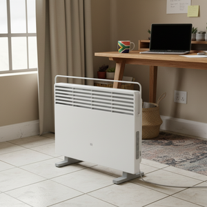 Xiaomi Smart Space Heater S EU positioned in a cozy room with a desk and plants, showcasing its sleek design.