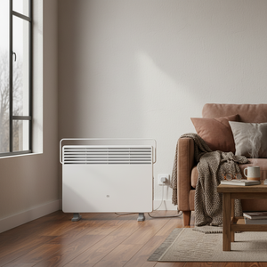Xiaomi Smart Space Heater S EU positioned beside a cozy sofa with cushions and a throw blanket.