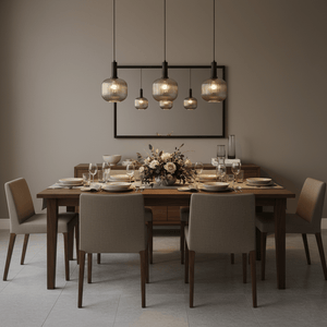 Elegant dining setup featuring multiple smoke cut glass pendant lights above a wooden table with floral centerpiece.