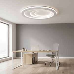 Modern flush ceiling light illuminating a stylish office space with a wooden desk and chair.