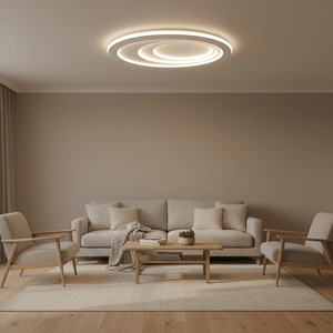 Modern flush ceiling light illuminating a cozy lounge with a sofa and armchairs.