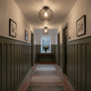 Stylish hallway featuring two black and brass ceiling lights with mesh detail, enhancing the ambiance.