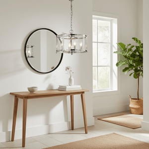 Candover Chrome & Glass Pendant Light hanging above a wooden console table with a mirror and decorative vase.