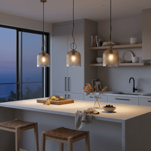 Three Chestnut Glass Pendants illuminate a modern kitchen island with a serene evening backdrop.