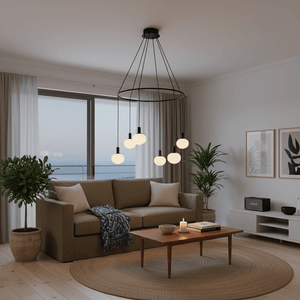Modern 6-light chandelier with opal glass orbs hanging above a cozy living room setting.