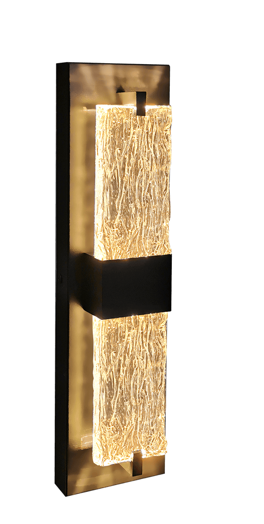 Modern wall-mounted light fixture with textured glass and metallic frame on a white background