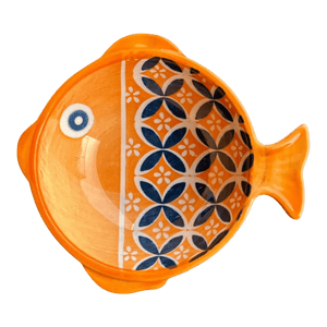 Ceramic fish-shaped bowl featuring an orange exterior and a patterned interior with blue and white floral designs.