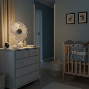 A bedside scene featuring a rechargeable fan on a dresser, with soft lighting and a crib in the background.
