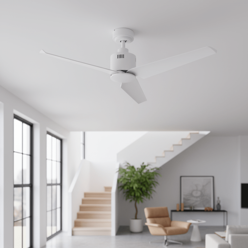 White metal ceiling fan with three blades, installed in a modern living space with large windows and a staircase.