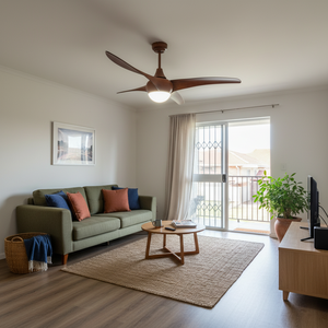 Stylish ceiling fan with wood finish above a modern lounge area featuring a green sofa and coffee table.
