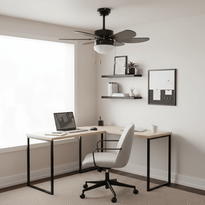 Black ceiling fan with 6 blades and opal glass light fixture above a modern desk setup in a bright room.