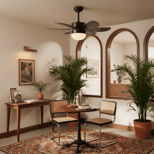 Stylish black ceiling fan with six blades and opal glass light in a cozy indoor setting with plants and a table.