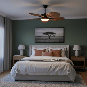 Modern bedroom with a ceiling fan, bed, and wall art.