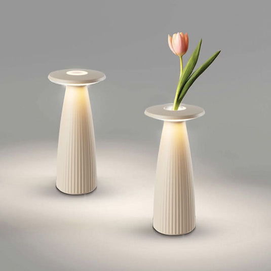 Two modern rechargeable LED table lamps with removable flower containers, softly illuminated.