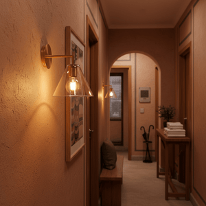 Gold wall light illuminating a hallway with textured walls and wooden accents.