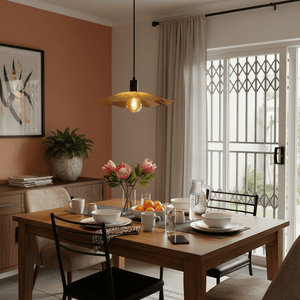 Golden Flower Pendant light hanging over a dining table set with dishes and flowers in a cozy interior.
