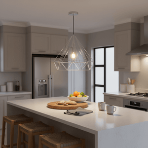 Chrome wire geometric pendant light with exposed bulb hanging over a kitchen island