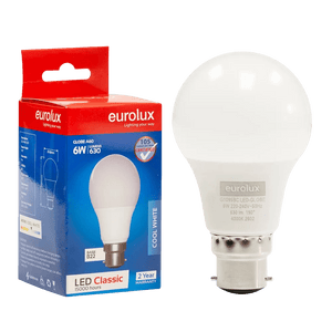 A 6W A60 LED bulb with a B22 base, placed next to its red and blue packaging, featuring a cool white finish.