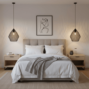 Black wire-mesh pendant light hanging above a stylish bed in a modern bedroom setting.