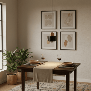 Cannon Black & Gold Marble Pendant Light hanging over a dining table set with wine glasses and plates.