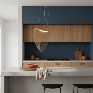 Elijah Natural LED Pendant hanging over a kitchen island with wooden cabinets and a dark blue wall.