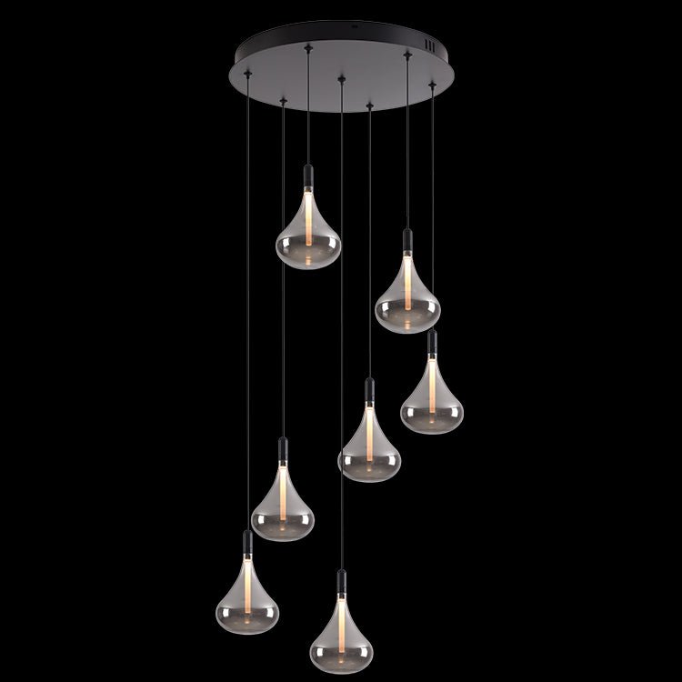 Modern pendant light with multiple glass bulbs on a black background