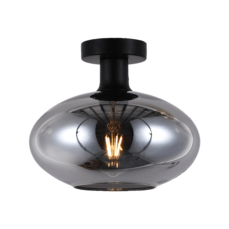 Ceiling light fixture with metallic shade and black fixture on a black background