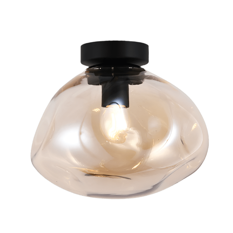 Clear glass ceiling light fixture with black fixture on a black background