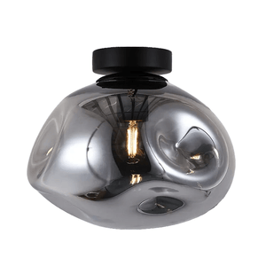 Flush‑mounted ceiling light with black circular base and irregular smoked glass shade, revealing an exposed Edison bulb.