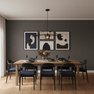Stylish dining area featuring the Sensu Large Infinite Black Pendant Light above a wooden table set for dinner.