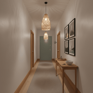 Rattan pendant lights hanging in a hallway, illuminating the space with warm, decorative light.