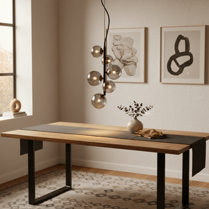 Stylish black pendant light with glass globes hanging above a wooden dining table, enhancing the modern decor.