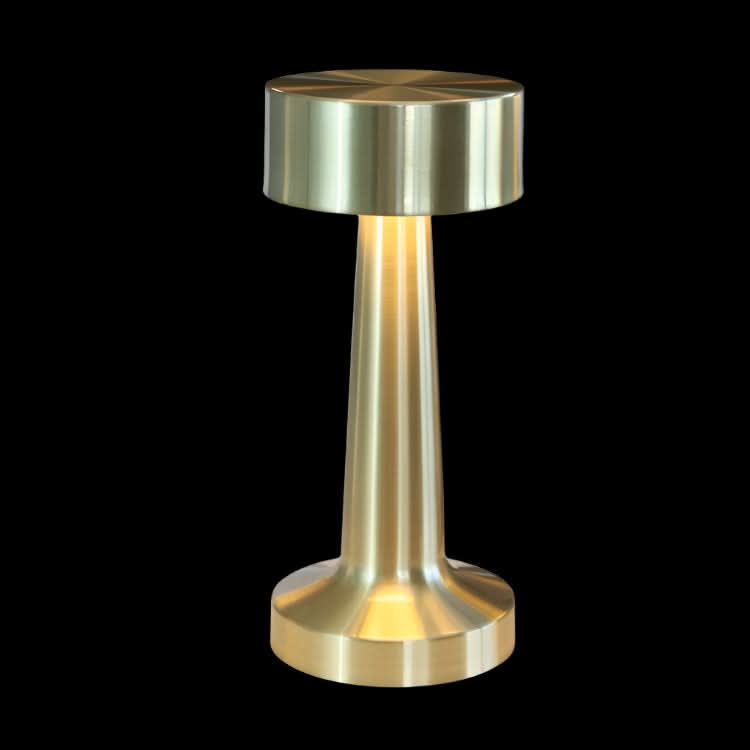 Metallic lamp with a cylindrical design on a black background