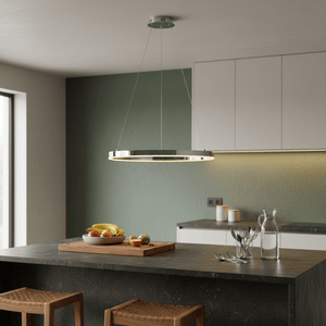 Chrome Hoop LED Pendant light hanging above a kitchen island with fruit bowl and utensils.