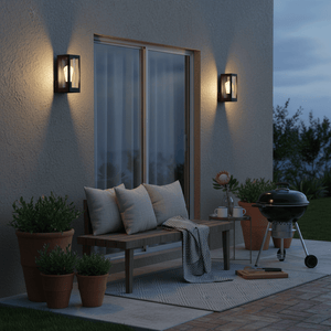 Outdoor scene featuring a Rayne wall light illuminating a cozy patio with a bench, potted plants, and a grill.