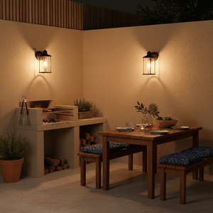 Contemporary outdoor wall light illuminating a dining area with a braai setup, enhancing ambiance.