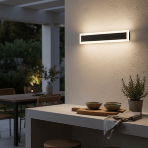 Linear Outdoor Short LED Wall Light mounted on a textured wall, emitting warm light.