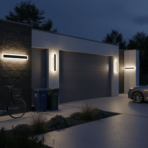 Nighttime exterior of modern house with linear LED wall lights on stone and white walls, bicycle, bins, and car visible.