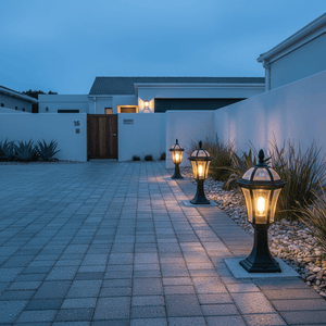 Eclipse 6 Panel Pillar Lights illuminating a modern driveway, enhancing visibility and aesthetics.