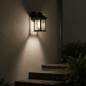 Outdoor wall light illuminating steps in the rain, showcasing its down-facing design and weatherproof features.