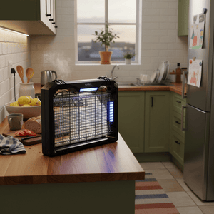 LED insect killer on a kitchen counter, attracting bugs with its blue light, surrounded by fresh produce.