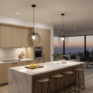 Two black pendant lights with wooden details hang over a marble kitchen island, illuminated softly.
