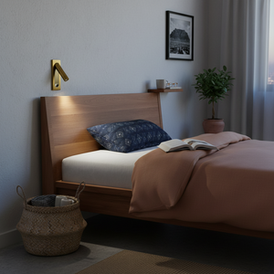 Recessed LED wall light mounted beside a wooden bed, illuminating a book on the bed.