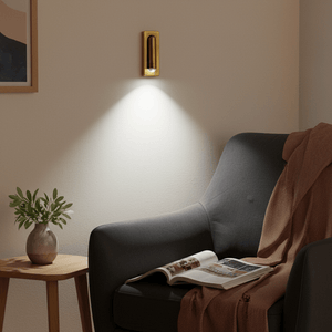 Recessed LED wall light illuminating a cozy reading nook with a book and plant.