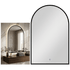 Arch-shaped mirror with black frame on a white background