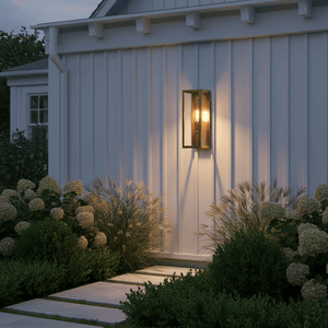 Belfort Lantern Box in antique brass mounted beside a covered entrance, illuminating the pathway.