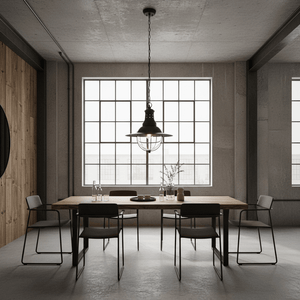 Wellington Hanging Lamp in matt black above a timber dining table with modern chairs and large windows.
