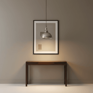 Seattle Hanging Lamp in antique silver above a wooden console table with framed artwork on the wall.